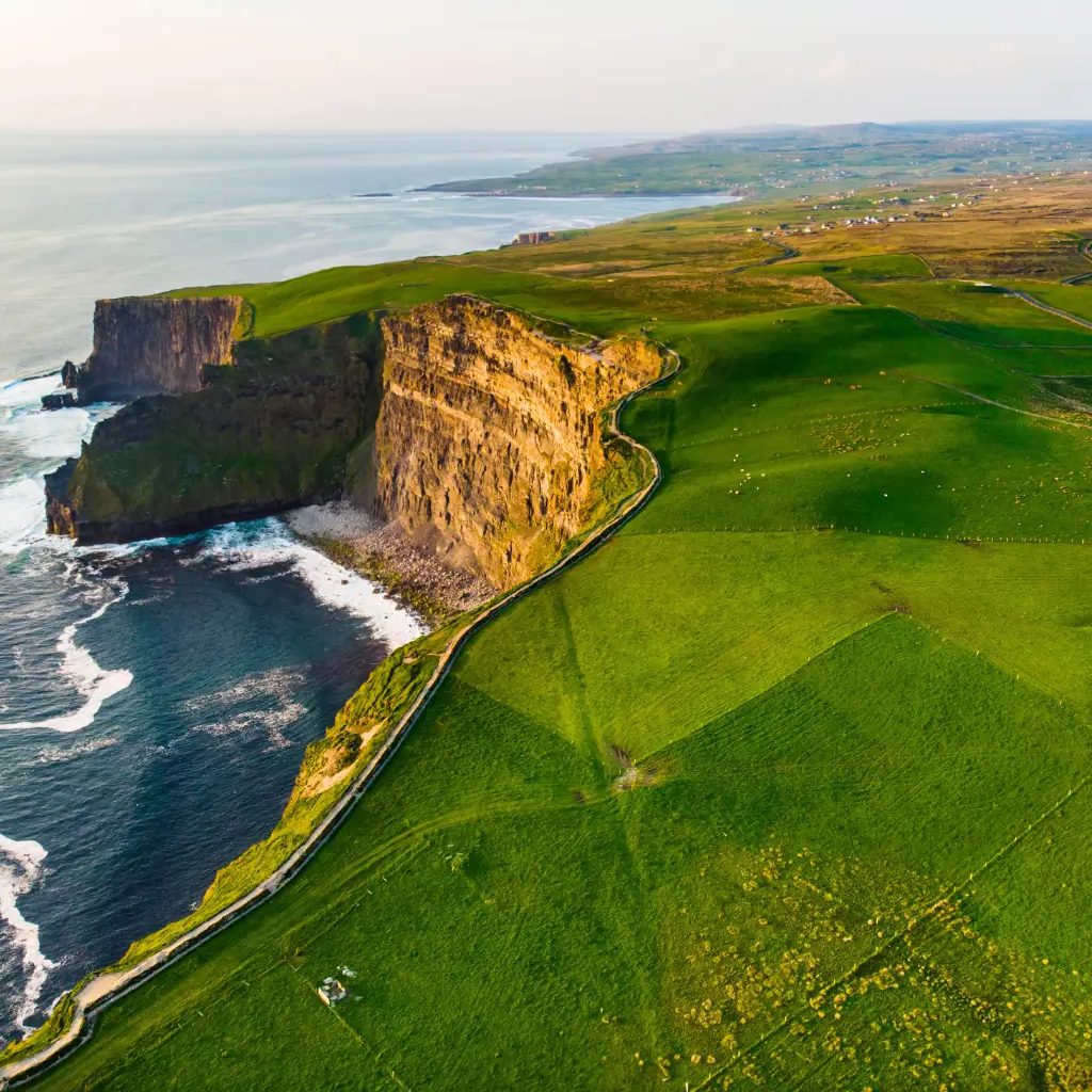 Aerial view of the scenic cliff walk beside the famous Cliffs of Moher and Doolin village in County Clare